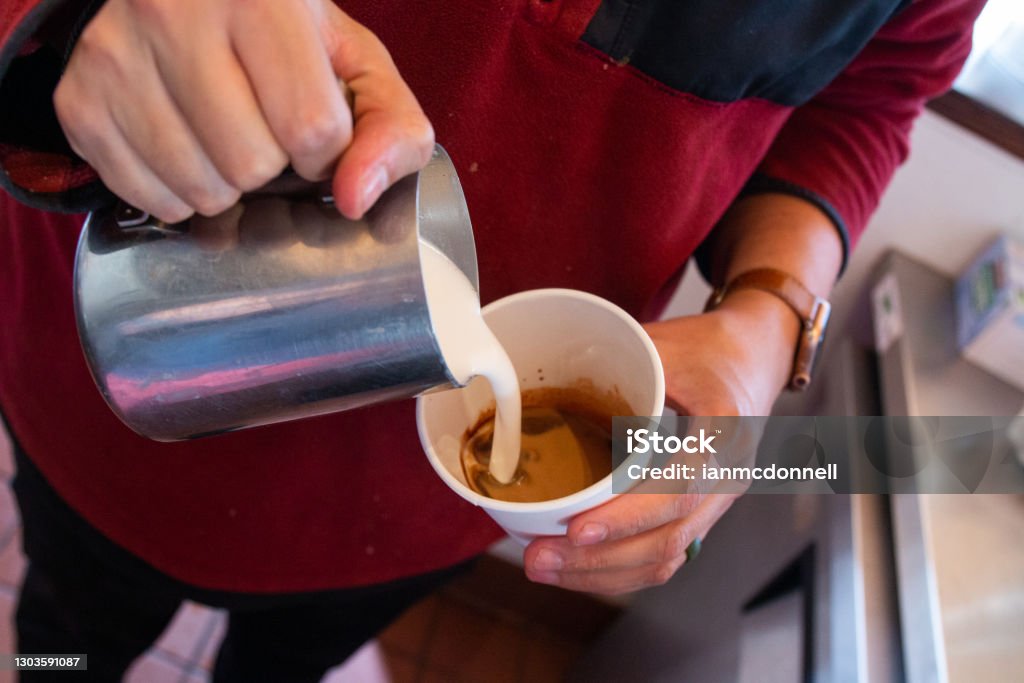 Pouring Milk into Latte Man making a latte 25-29 Years Stock Photo