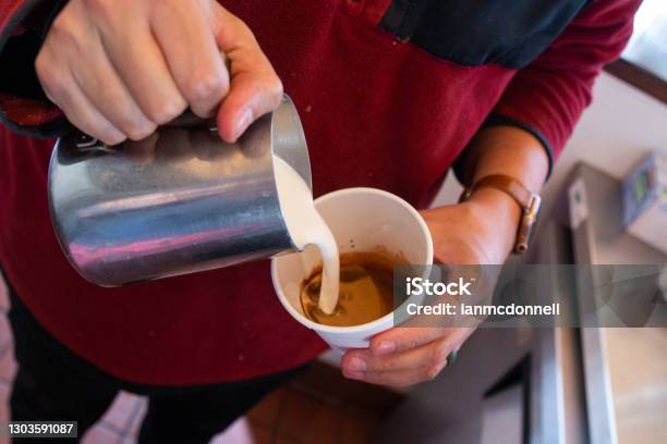 Pouring Milk Into Latte Stock Photo - Download Image Now - 25-29 Years, Barista, Business