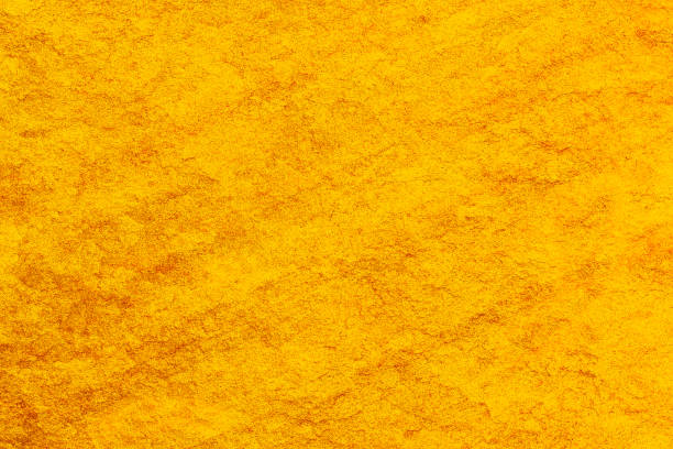 istock Rough concrete surface abstract golden texture for background 1303592816