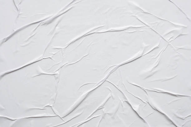 istock Blank white crumpled and creased paper poster texture background 1303593423