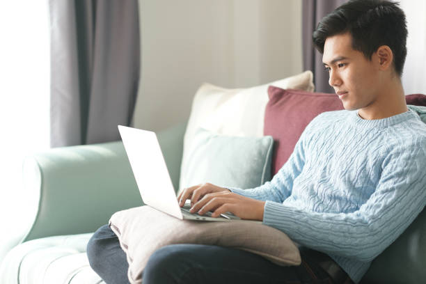istock asian young student man entrepreneur working with computer studying learning online at home. e-learning webinar meeting. social distance in covid pandemic 1303593424