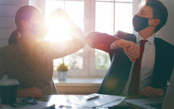 istock Man and woman are working in office 1303594188