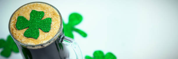 istock Black beer and shamrock for St Patricks Day 1303597804
