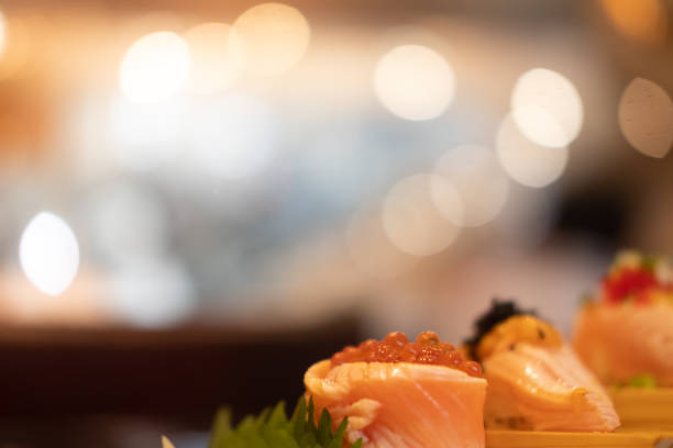 istock Selective focus on rolls salmon topped with salmon roe against bokeh background 1303597851