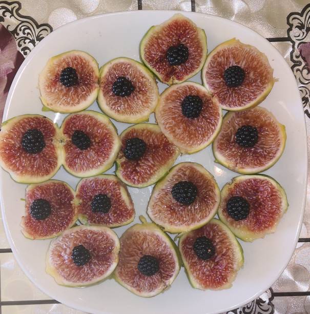 Fresh figs and  blackberries on a plate
