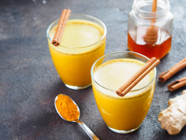 istock golden turmeric latte and ingredients, copy space 1303603531