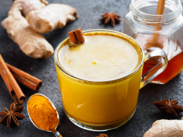 istock golden turmeric latte and ingredients, copy space 1303603550