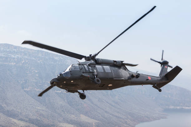 istock UH-60 Black Hawk Black military helicopter in flight 1303604665