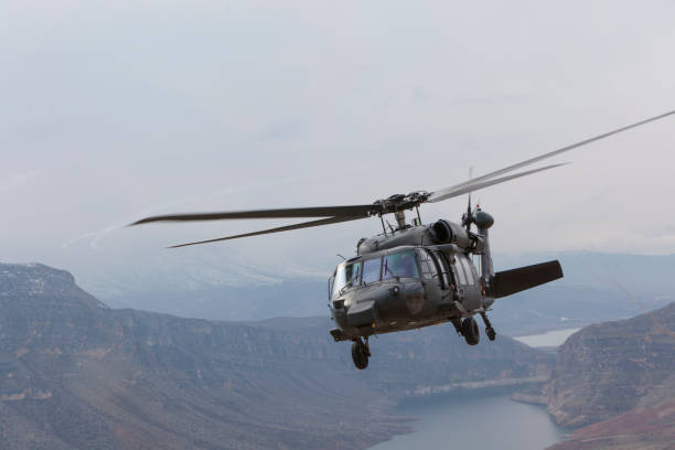 istock Black military helicopter in flight 1303604667