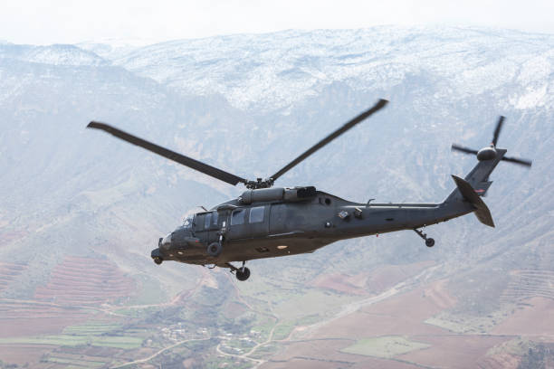 istock UH-60 Black Hawk Military Helicopter flying 1303604694