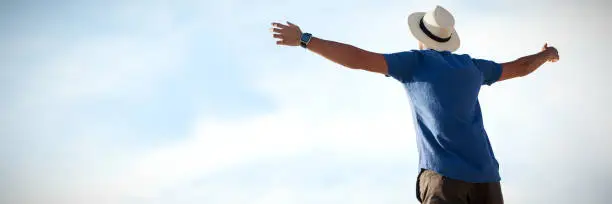 Photo of Composite image of low angle of a man raising arms up