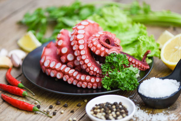 istock cooked squid salad chili sauce seafood cuttlefish dinner restaurant, Boiled octopus tentacles, Octopus food on wooden background 1303611934