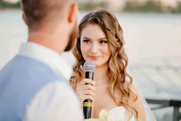 istock wedding vows. beautiful ceremony by the water on the dock. 1303615998