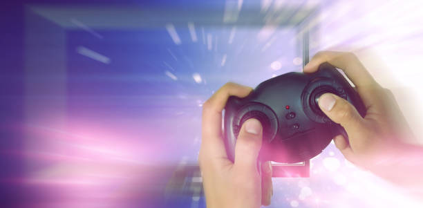 istock Composite image of cropped image of hands holding controller 1303616137