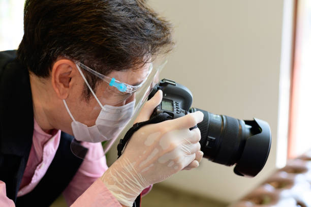 istock Photographer at work during covid-19 pandemic 1303616210