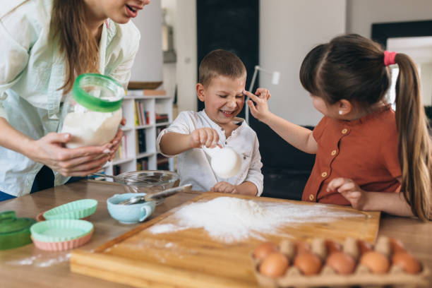 istock children baking with their mother at home 1303616833