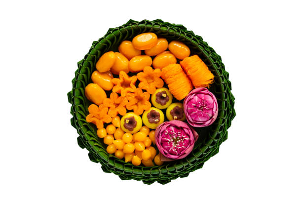 Thai wedding desserts on banana leaves plate Thai wedding desserts on banana leaves plate or krathong for thai traditional ceremony isolated on white background. krathong stock pictures, royalty-free photos & images