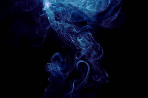 istock Colored fumes on black background 1303618566