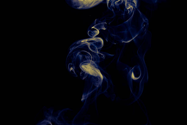 istock Colored fumes on black background 1303619316