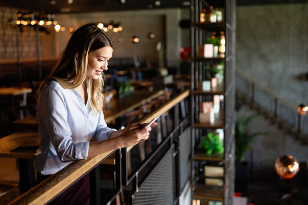 istock Beautiful woman using mobile phone. Business, technology, social network concept 1303619328