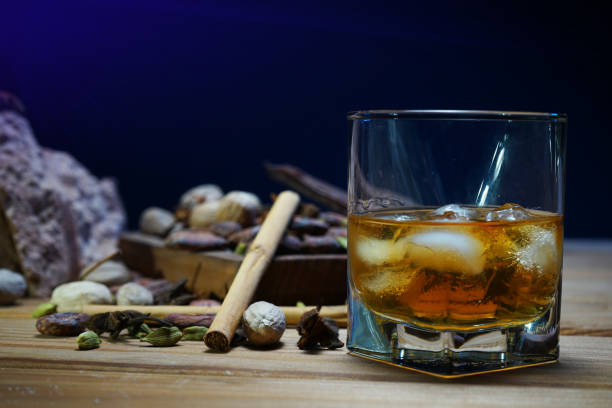 istock Cocoa beans, cinnamon, raisins, caramel sugar, chocolate, nuts on a wooden table. 1303620005