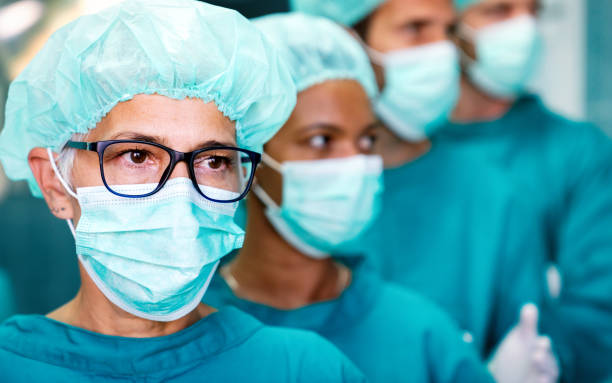 istock Hospital medical surgery team is ready for the operation 1303621121