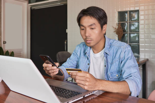 istock Zoom View Casual Businessman Using Smartphone for Online Payment 1303622229
