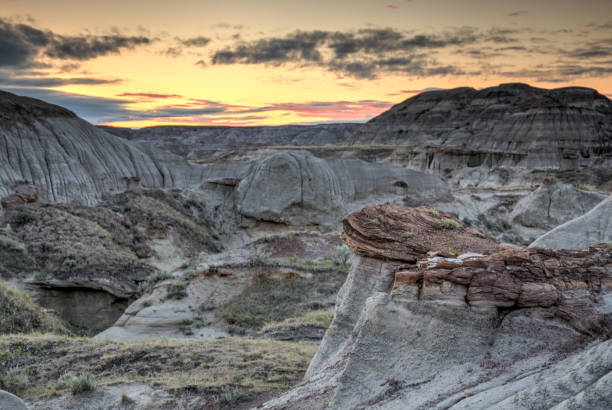 istock sunset over desert valley, Dinosaur Provincial Park, Alberta 1303622750