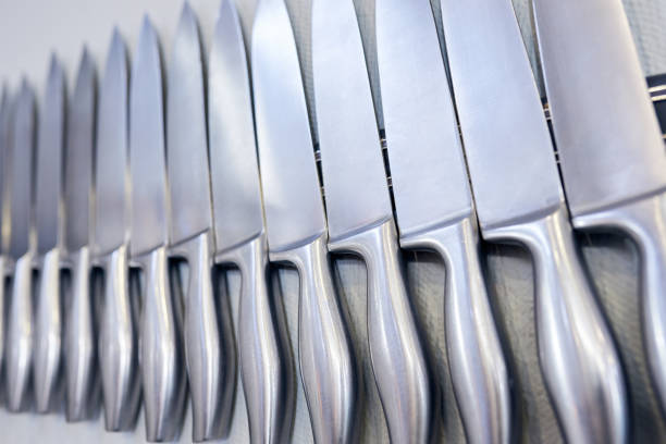 istock A set of knifes are hanging on a kitchen wall. 1303623633