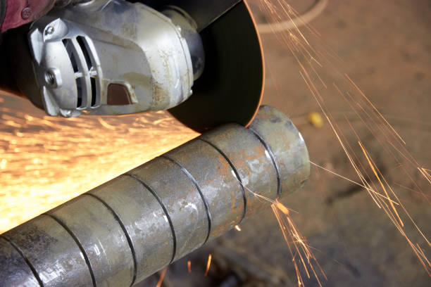 istock cutting of round metal slab with angle grinder 1303623684