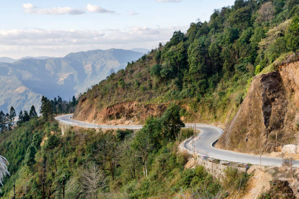 istock Winding asphalt rural road in Yuanyang 1303624014