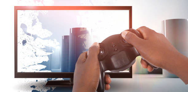 istock Composite image of hand of man playing video game against white background 1303625747