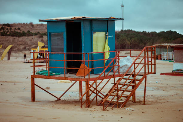 istock Empty Lifeguard Hut on The Beach With Blue and Orange Walls 1303627377
