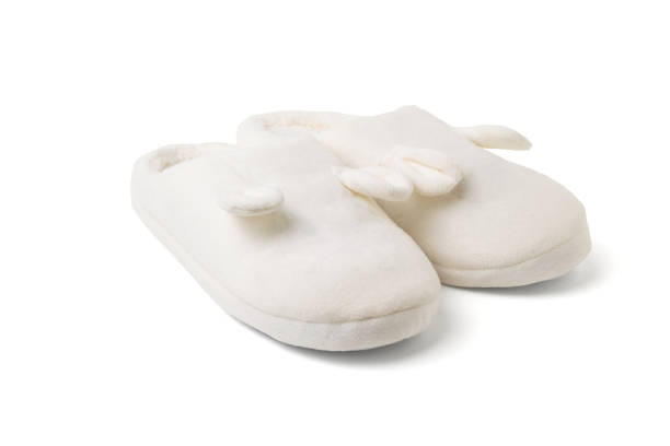 istock Stylish white home slippers isolated on a white background. 1303630422