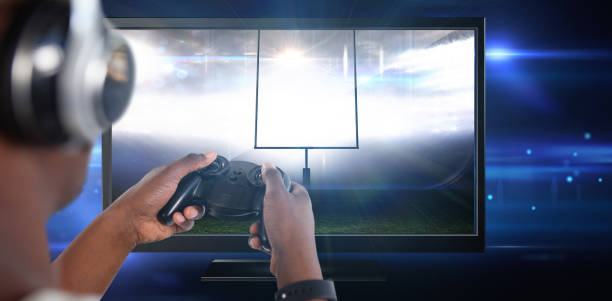 istock Composite image of man playing video game against white background 1303632348