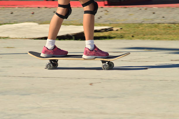 istock young girl skateboarding in the square 1303633603