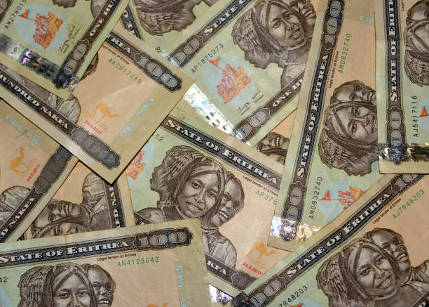 istock Eritrean nakfa bank notes - 100 ERN in random arrangement 1303638877