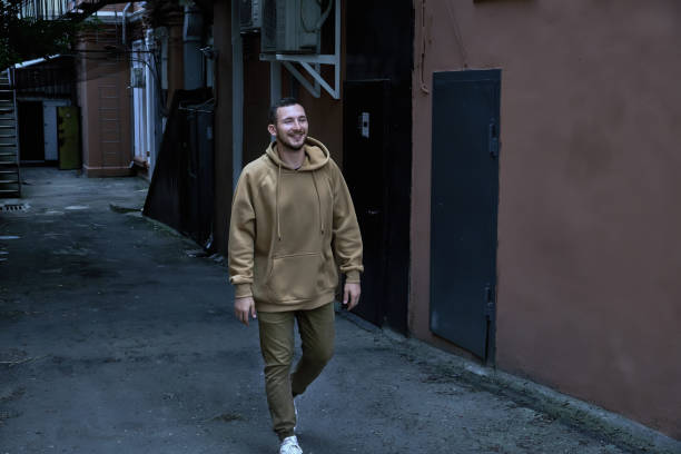 istock A guy in a tracksuit walks through the city 1303640018