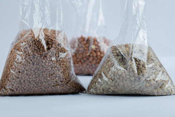 istock Different kinds of beans packed on a gray background 1303643233