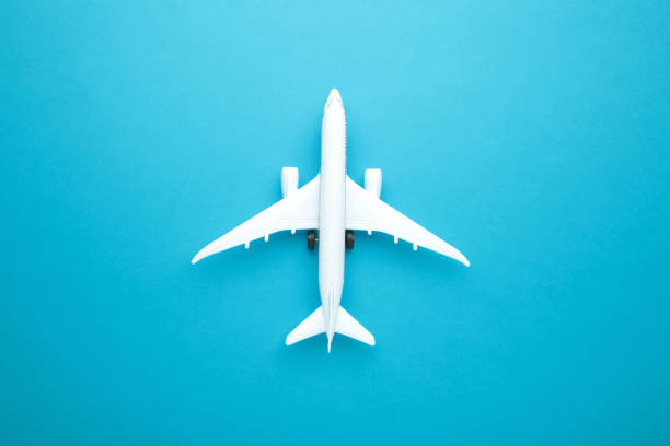 istock Model airplane on blue pastel color background. 1303643551