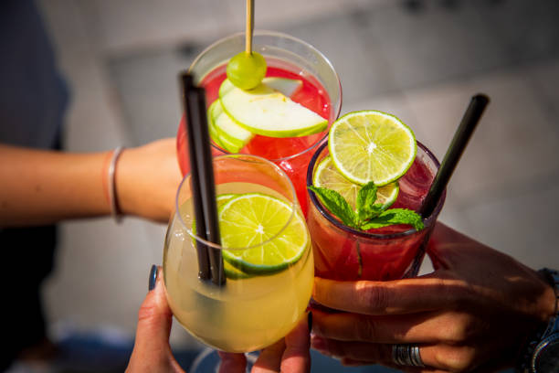 istock Holding cocktails together in a toast 1303643959