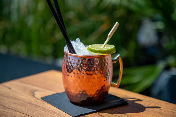 istock Copper jug full of crushed ice, cocktail with lime slice 1303643991