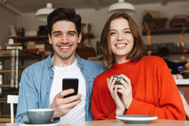 istock Astonished young couple sitting 1303644970