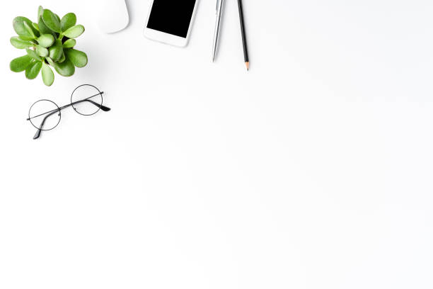 istock Elegant office desktop with business accessories isolated on white background with copyspace. Top view 1303646617