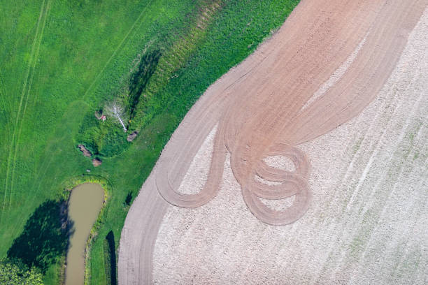 istock aerial view over the rural fields and pond 1303647494