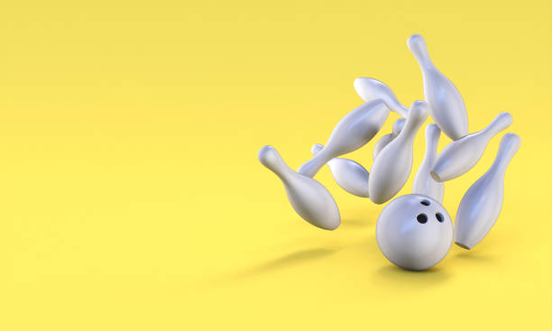 istock gray bowling ball and pin on a yellow background. 1303647775
