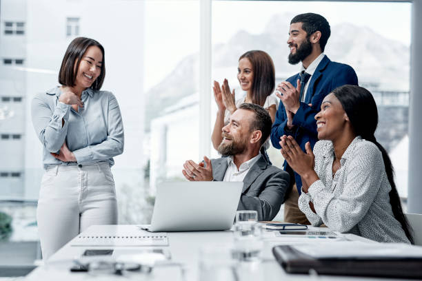 istock Congratulating a colleague on her great accomplishment 1303650309