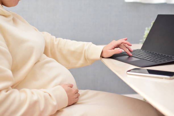 istock pregnant woman working from home 1303650740