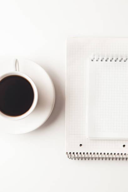 istock Office desk table with supplies, coffee cup and flower. Top view 1303651968