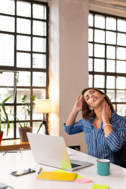 istock Businesswoman suffering from neckache 1303652856